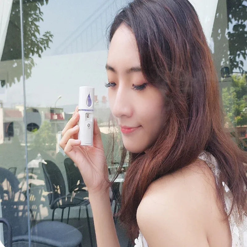 Portable facial steamer and mist sprayer with rechargeable battery, weighing 50g and measuring 10.5x3cm.