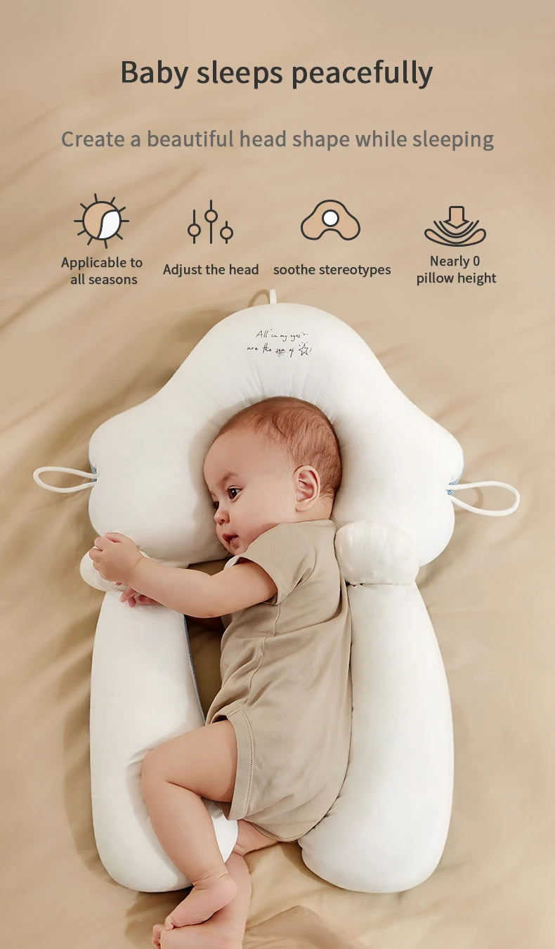 Adjustable pillow cradles newborns for comfortable sleeping and head shaping.